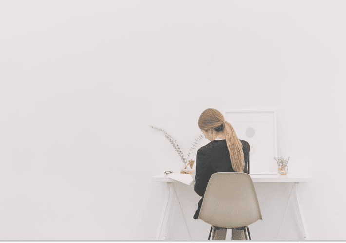 lady sitting in front of a work desk